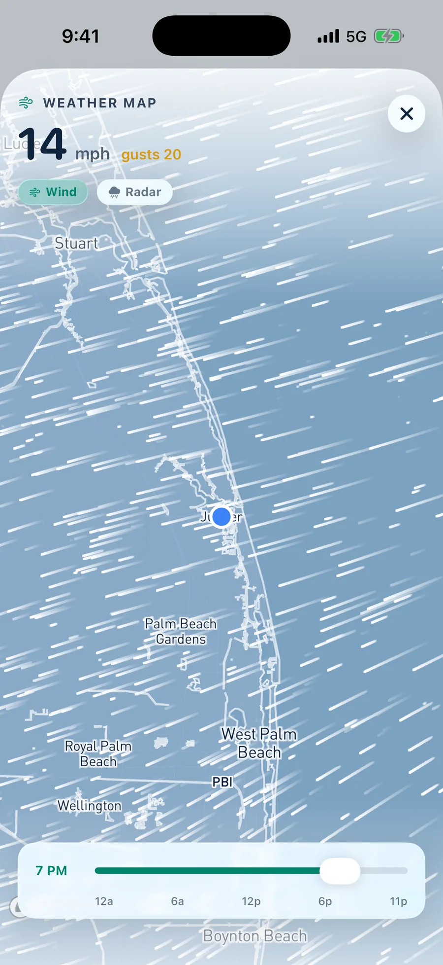 Animated wind flow field over the Florida coast, streaks running white over the water with the shoreline and place names legible underneath, an hour by hour scrubber and a radar toggle